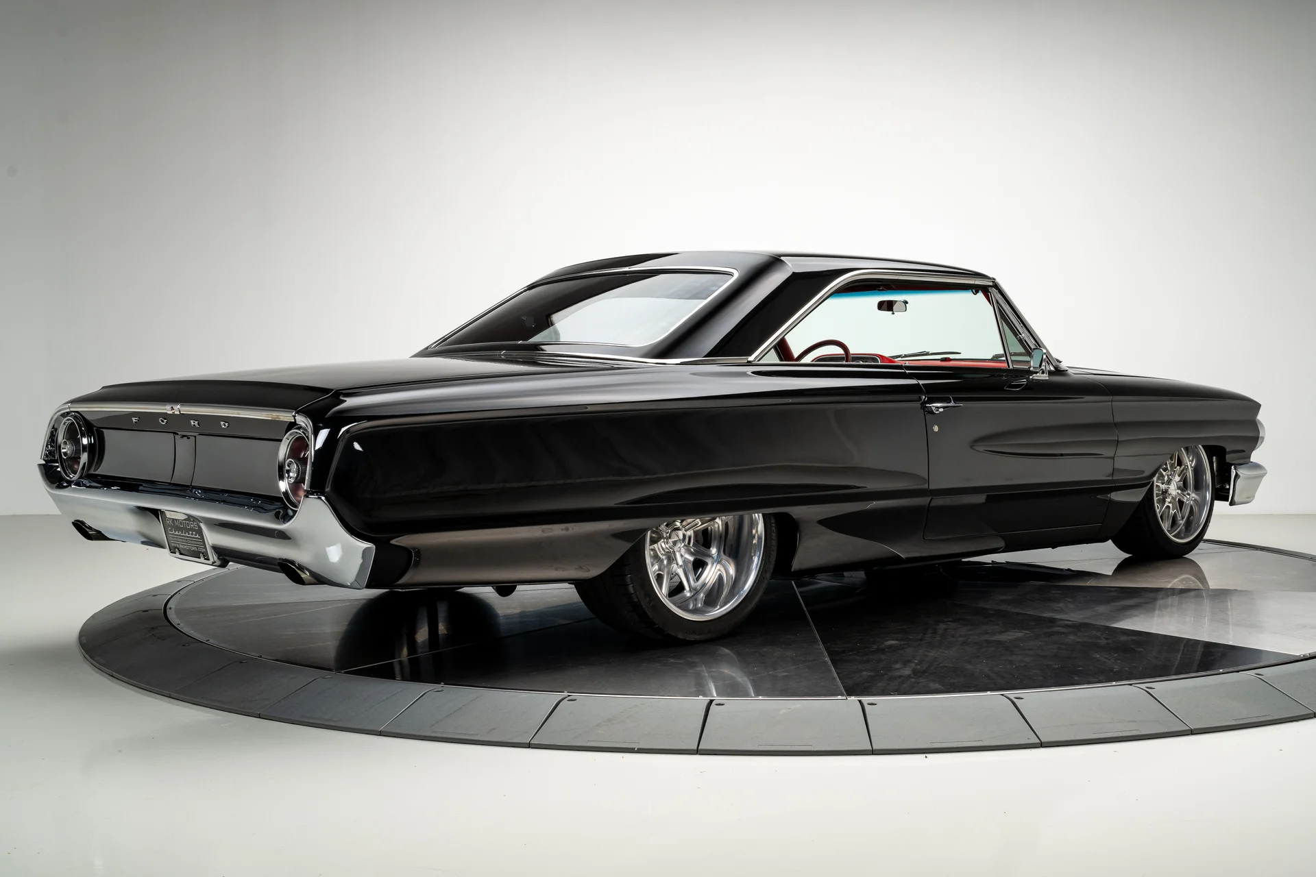 Sleek black classic car  at auto shop